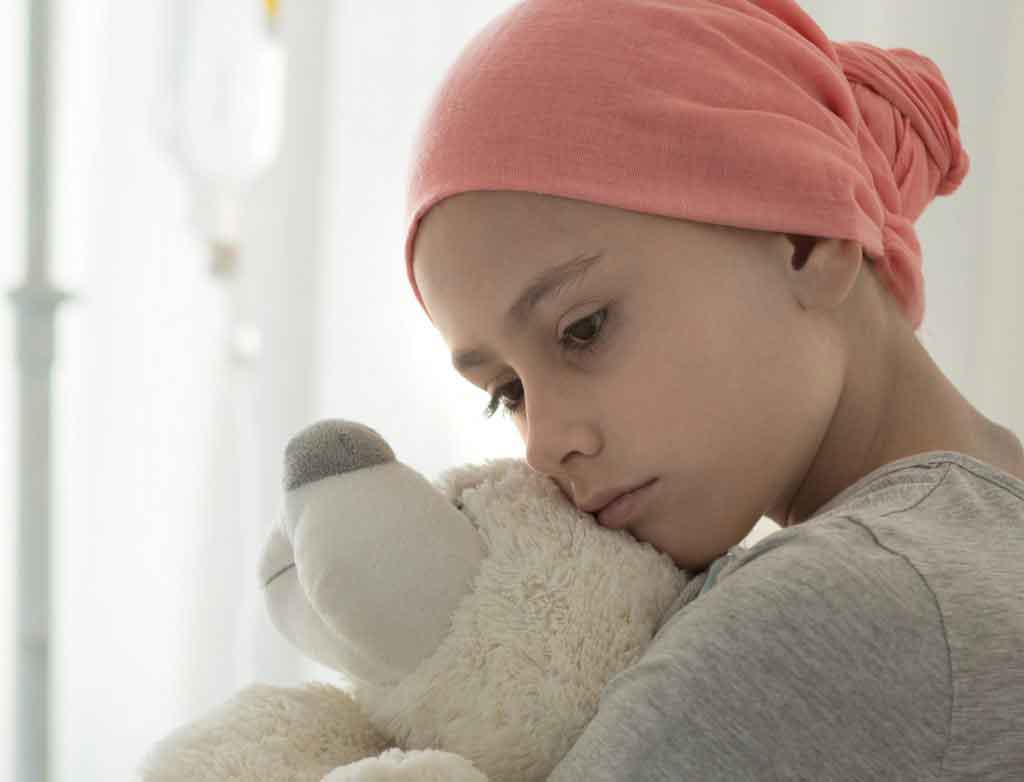 Weak Girl With Cancer Wearing Pink Headscarf And Hugging Teddy Bear 